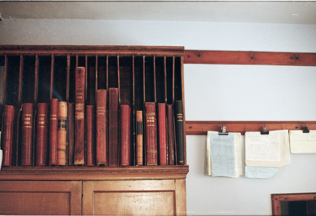 wooden-shelf-filled-with-antique-books-99cw5goxcby